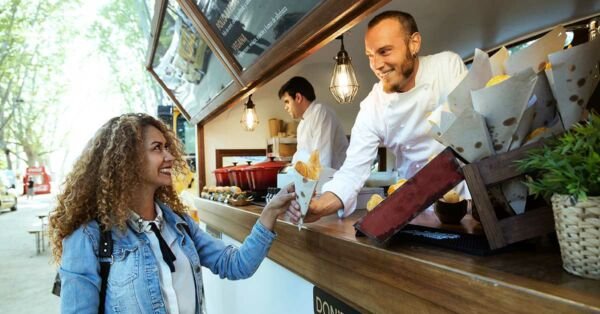 Small business owner serving a customer